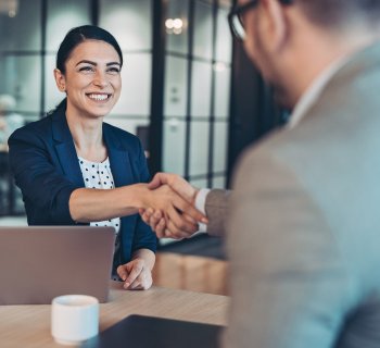 woman and man shaking hands