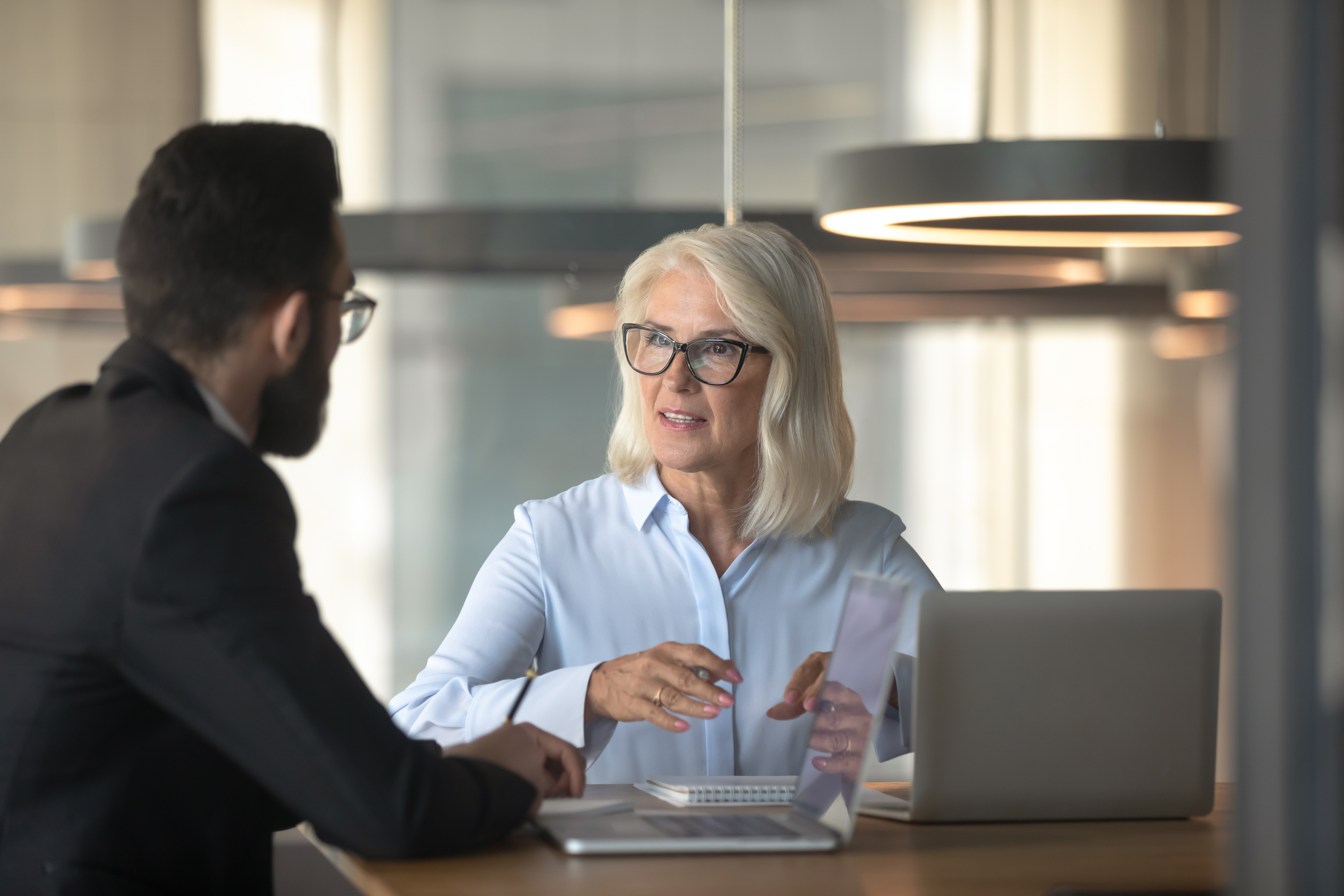 business woman and business man talking